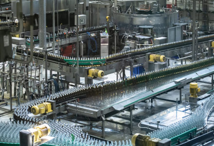 Beer,Bottles,Moving,On,Automated,Conveyor,Line,Or,Belt.,Industrial